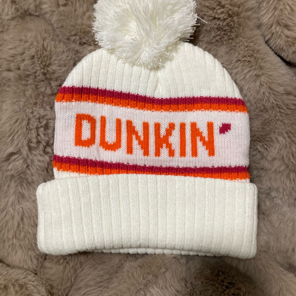 Dunkin Pom-Pom Beanie off white with Dunkin branding.